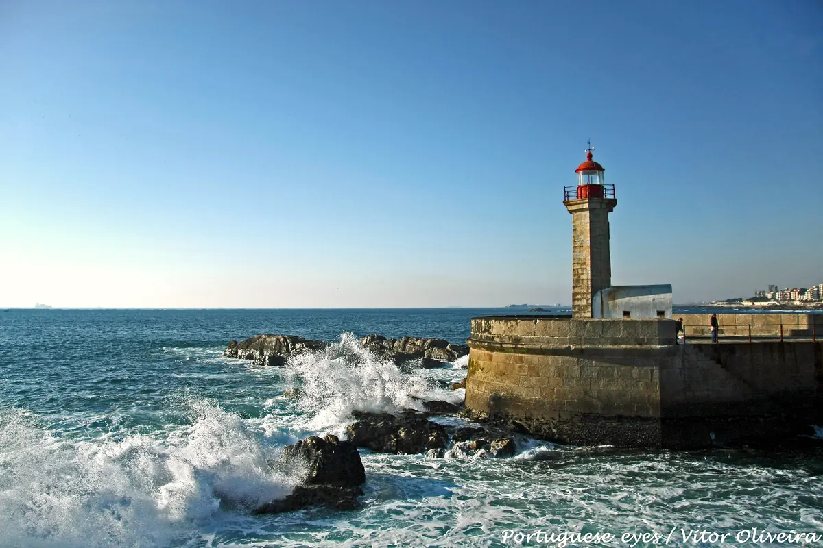 Waves breaking at Felgueiras lighthouse in Foz do Douro