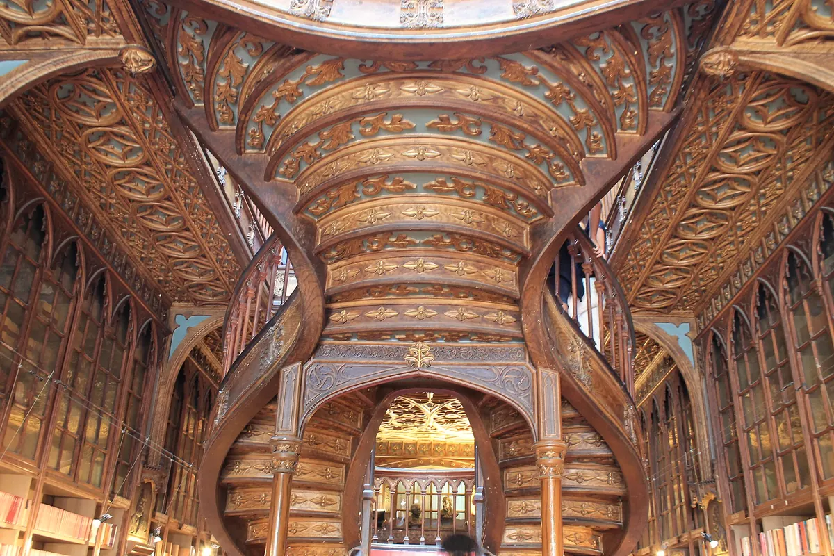 The carved neo-Gothic ceiling of Livraria Lello