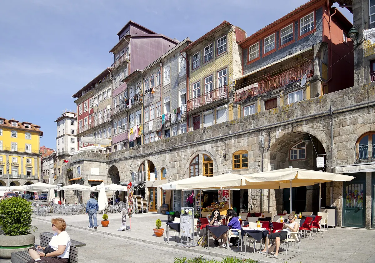 Café terraces under the arcades of Praça da Ribeira